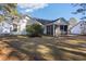 Back of house, showing screened porch and yard at 5933 Rahnavard Blvd., Myrtle Beach, SC 29588