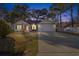 House exterior at dusk with driveway and landscaping at 5933 Rahnavard Blvd., Myrtle Beach, SC 29588