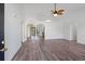 Bright living room with wood floors, stylish lighting, and arched doorways to other rooms at 5933 Rahnavard Blvd., Myrtle Beach, SC 29588