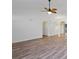 Open-concept living room featuring hard surface floors, arched entries and a modern ceiling fan at 5933 Rahnavard Blvd., Myrtle Beach, SC 29588