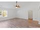 Spacious living room with wood-look floors, vaulted ceilings, and an abundance of natural light at 5933 Rahnavard Blvd., Myrtle Beach, SC 29588