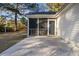 Exterior view of a screened-in porch offering a seamless transition to the outdoors at 5933 Rahnavard Blvd., Myrtle Beach, SC 29588