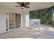 Charming screened-in porch with ceiling fan and sliding glass door at 5933 Rahnavard Blvd., Myrtle Beach, SC 29588