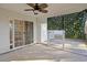 Enclosed porch with fan, offering seamless transition to outdoor living and entertaining at 5933 Rahnavard Blvd., Myrtle Beach, SC 29588