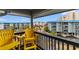 Balcony with yellow chairs and ocean view at 6000 N Ocean Blvd. # 317, North Myrtle Beach, SC 29582