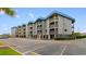 Coastal condo building with parking and ocean views at 6000 N Ocean Blvd. # 317, North Myrtle Beach, SC 29582