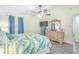 Second bedroom with a queen-size bed and large dresser at 6001-1654 South Kings Hwy., Myrtle Beach, SC 29575