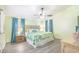 Spacious main bedroom with a king-size bed and ceiling fan at 6001-1654 South Kings Hwy., Myrtle Beach, SC 29575