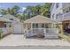 Tan house with white porch and detached garage at 6001-1654 South Kings Hwy., Myrtle Beach, SC 29575