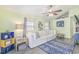 Living room with white couch, blue rug, and decorative shelves at 6001-1654 South Kings Hwy., Myrtle Beach, SC 29575