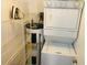 Laundry room with washer, dryer, water heater, and shelving at 6001-1655 South Kings Hwy., Myrtle Beach, SC 29575