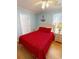 Cozy bedroom with red bedding, nautical decorations, and natural light from the window at 6001-1709 South Kings Hwy., Myrtle Beach, SC 29575