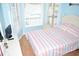 Comfortable bedroom featuring full bed, night stand and large window at 6001-1709 South Kings Hwy., Myrtle Beach, SC 29575