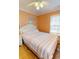 Bright bedroom with a full bed, nightstand, and overhead lighting at 6001-1709 South Kings Hwy., Myrtle Beach, SC 29575