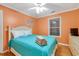 Bedroom with queen bed and light orange walls at 6001-1709 South Kings Hwy., Myrtle Beach, SC 29575