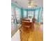 Bright dining area features a large table, wood floors, and bay windows offering ample natural light at 6001-1709 South Kings Hwy., Myrtle Beach, SC 29575