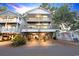 Inviting stilt home with covered parking and multiple decks, perfect for enjoying the outdoors and ocean breezes at 6001-1709 South Kings Hwy., Myrtle Beach, SC 29575