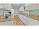 Bright kitchen with white cabinets, granite countertops, and ample storage space at 6001-1709 South Kings Hwy., Myrtle Beach, SC 29575