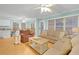 Spacious living room with neutral tones, comfortable seating, and a ceiling fan at 6001-1709 South Kings Hwy., Myrtle Beach, SC 29575