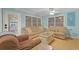Comfortable living room with two couches, natural light, and access to a balcony at 6001-1709 South Kings Hwy., Myrtle Beach, SC 29575