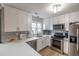 Modern kitchen with white cabinets and stainless steel appliances at 603 Hatteras River Rd., Myrtle Beach, SC 29588