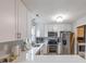 Modern kitchen with white cabinets and stainless steel appliances at 603 Hatteras River Rd., Myrtle Beach, SC 29588