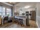 Modern kitchen with island, white cabinets, and stainless steel appliances at 603 Hatteras River Rd., Myrtle Beach, SC 29588