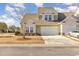 Two-story townhome with attached garage and manicured lawn at 6172 Catalina Dr. # 911, North Myrtle Beach, SC 29582