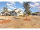 Two-story house with light green siding, and a large yard at 6172 Catalina Dr. # 911, North Myrtle Beach, SC 29582