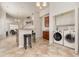 Convenient laundry room with washer, dryer, and storage cabinets at 6172 Catalina Dr. # 911, North Myrtle Beach, SC 29582