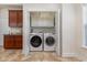 Clean laundry room with washer, dryer, and overhead storage at 6172 Catalina Dr. # 911, North Myrtle Beach, SC 29582