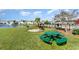 Green picnic table near pond with grill and fountain at 6172 Catalina Dr. # 911, North Myrtle Beach, SC 29582