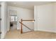 Upper level hallway with neutral carpeting and stairs at 6172 Catalina Dr. # 911, North Myrtle Beach, SC 29582