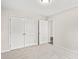 Bedroom with double doors and carpet at 626 Lightwood Dr., Conway, SC 29526