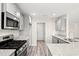 Modern kitchen with gray cabinets, granite countertops and stainless steel appliances at 626 Lightwood Dr., Conway, SC 29526