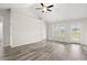 Bright and airy living room with hardwood floors and multiple windows at 626 Lightwood Dr., Conway, SC 29526