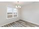 Dining area with large window and chandelier at 640 Woodside Dr., Conway, SC 29526