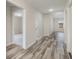 Bright hallway with light gray walls and wood-look flooring at 640 Woodside Dr., Conway, SC 29526