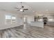 Open concept kitchen with gray cabinets, granite counters, and stainless steel appliances at 640 Woodside Dr., Conway, SC 29526