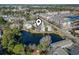 Aerial view of house location near a pond and other buildings at 6624 Lagoon Pl., Myrtle Beach, SC 29572