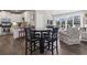 Kitchen and dining area with four chairs and access to deck at 6624 Lagoon Pl., Myrtle Beach, SC 29572