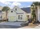 Charming light green house with a two-car garage and landscaping at 6624 Lagoon Pl., Myrtle Beach, SC 29572