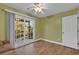 Bedroom with wood floors and sliding glass doors to patio at 670 2Nd Ave. N, North Myrtle Beach, SC 29582