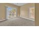 Bedroom with carpet, sliding glass doors, and a window at 670 2Nd Ave. N, North Myrtle Beach, SC 29582