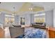 Bright living room with hardwood floors, vaulted ceiling and neutral decor at 670 2Nd Ave. N, North Myrtle Beach, SC 29582