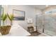 Bathroom with marble shower, white vanity, and modern decor at 690 Choctaw Dr., Conway, SC 29526