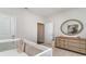 Bright bedroom with a white crib, a decorative mirror, and a dresser at 690 Choctaw Dr., Conway, SC 29526