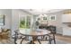 Cozy dining area with a rustic table, modern chairs, and access to a patio at 690 Choctaw Dr., Conway, SC 29526