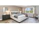 Comfortable main bedroom with large window offering natural light, neutral decor, and elegant furnishings at 690 Choctaw Dr., Conway, SC 29526