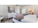 Tastefully decorated main bedroom with neutral walls, a cozy throw blanket and hardwood flooring at 690 Choctaw Dr., Conway, SC 29526